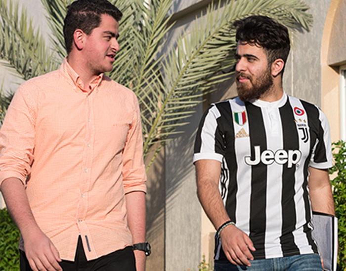 Abu Dhabi University student talking to each other in campus