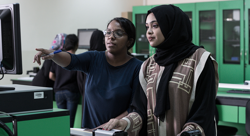 Female MSc IT student giving a testimonial at Abu Dhabi University in a professional indoor setting. (9