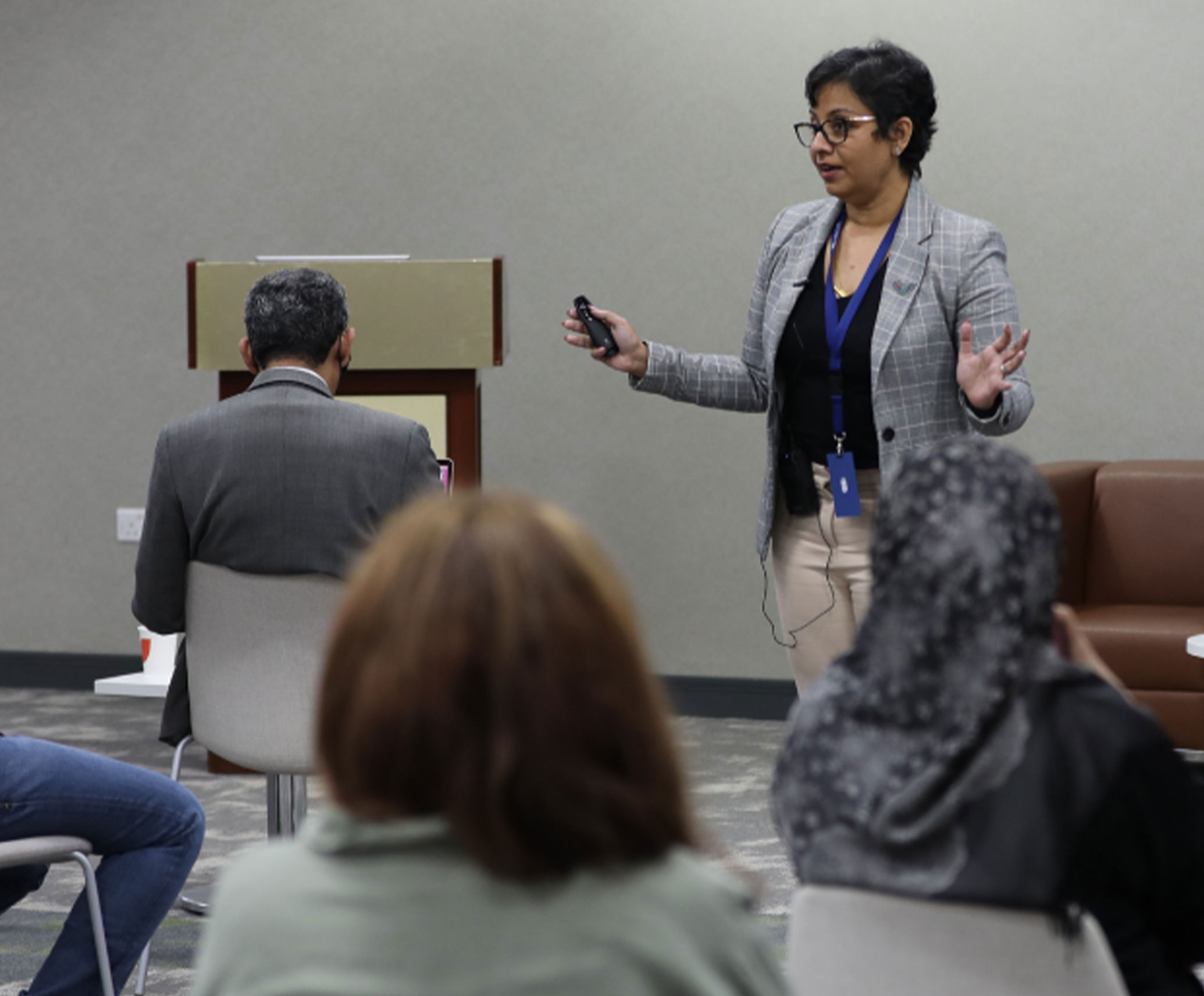 Faculty members in discussion during a review board meeting