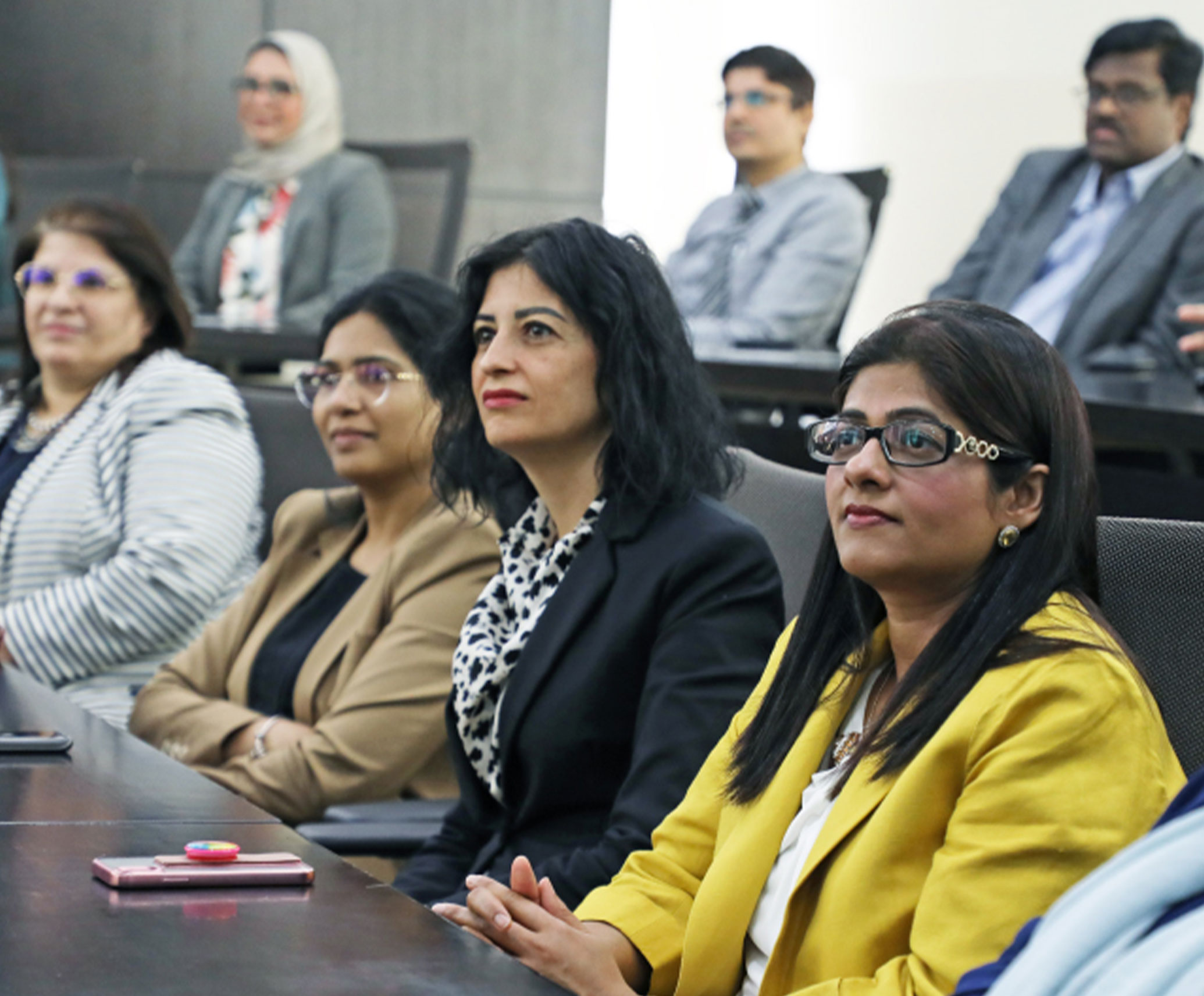 Faculty member leading a research session, highlighting academic objectives at Abu Dhabi University